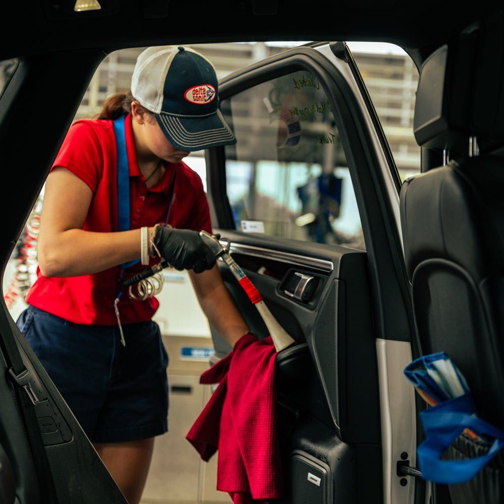 Delta Sonic employee performing Express Interior service
